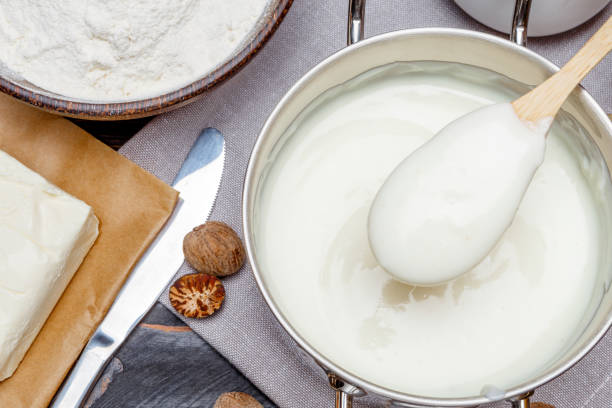 istock bechamel sauce in a pan and ingredients 679508836