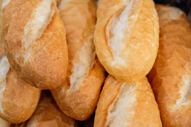 ศoaf of bread-  Fresh bread prompt to serve. Bread loaves background.