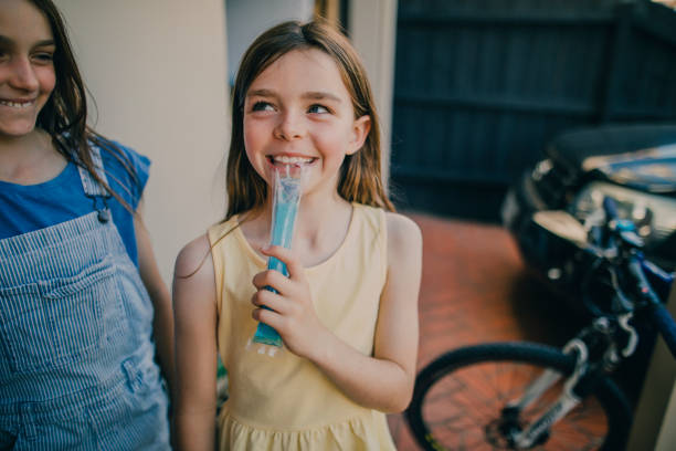 Little Girl Eating an Ice Pop