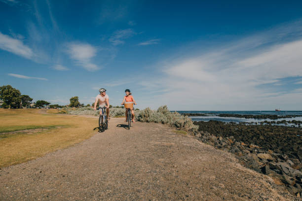istock Young Couple Cycling in the Park 679511740