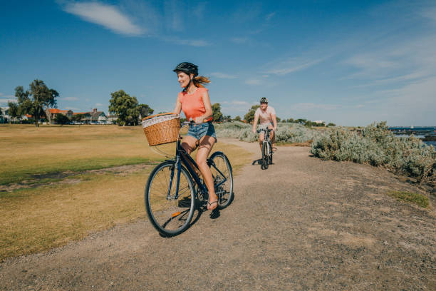 istock Young Couple Cycling in the Park 679511766