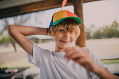 Portrait of Young Boy Wearing a Propeller Hat