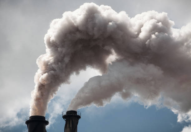 istock Clouds of smoke from industrial chimneys 679513040