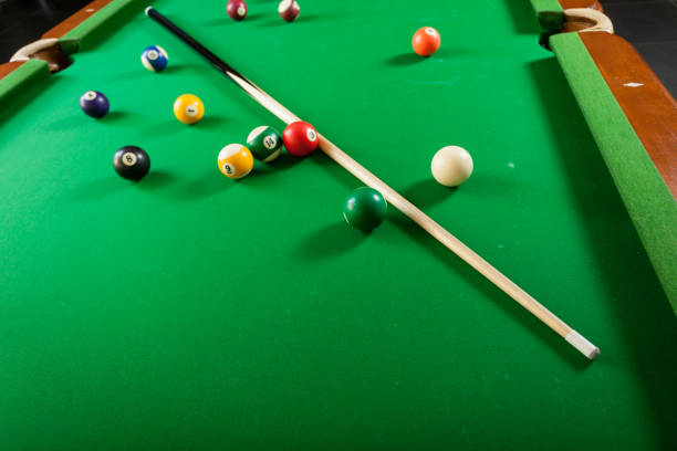 istock Snooker ball and stick on billiard table 679514058