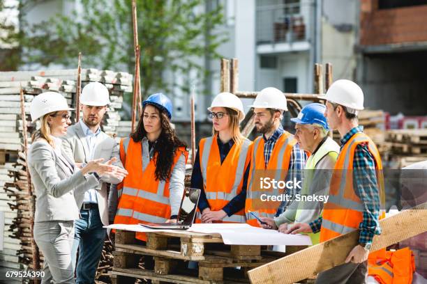 Construction Workers Stock Photo - Download Image Now - Construction Site, Construction Industry, Meeting