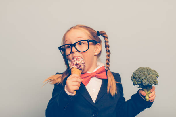 Young Female Nerd Eats Ice Cream and Holds Broccoli