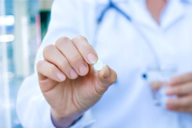 istock The doctor gives a pill . 679524828