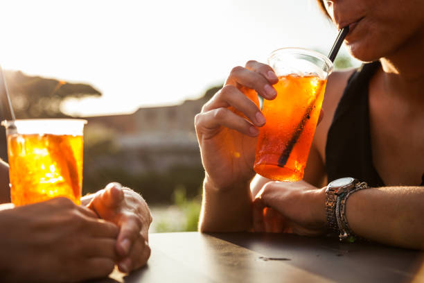 istock Woman drinking enjoying a summer happy hour 679528116
