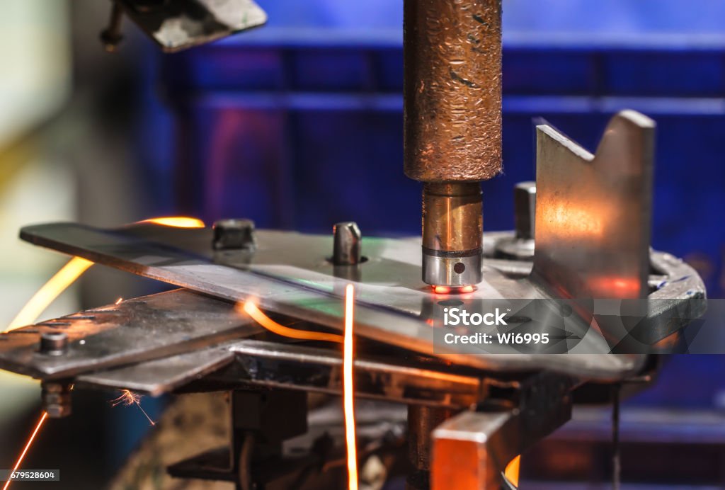 Spot welding machine automotive part. Spot welding machine Industrial automotive part in factory Spotted Stock Photo