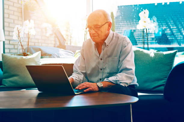 istock Senior man works at home with laptop 679532308