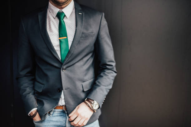 Businessman in a suit on a dark background