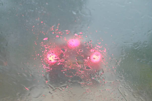 cloud break with heavy rain and bad sight blurred car lights.