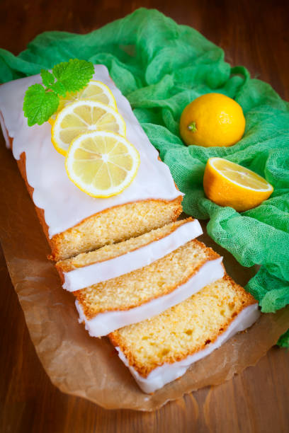 istock Homemade lemon pound cake with sweet lemon icing on rustic wooden table, sliced. 679553012