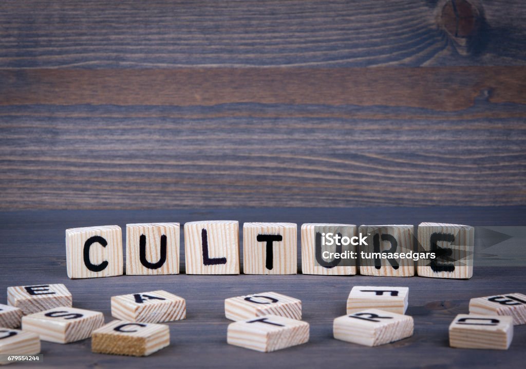 Culture word written on wood block Culture word written on wood block. Dark wood background with texture. Cultures Stock Photo