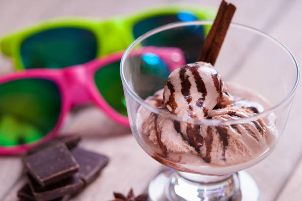 istock Ice cream sundae, spices, chocolate pieces and sun glasses 679555000