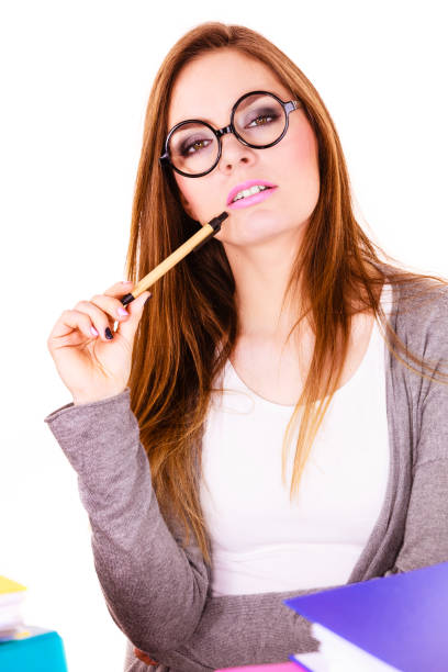 istock Woman sitting at desk in office and thinking 679555426