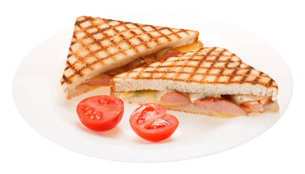 istock Sausage grilled cheese sandwich with tomato on a plate. Isolated on white background. 679555930