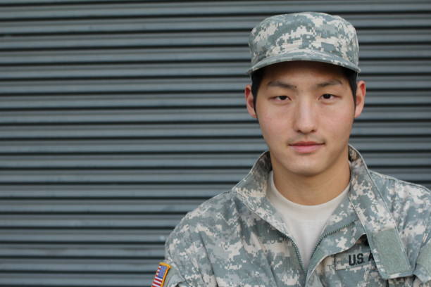 istock Army Asian male isolated on gray 679558182