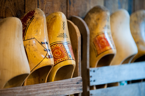 Old wooden clogs hanging on the wall