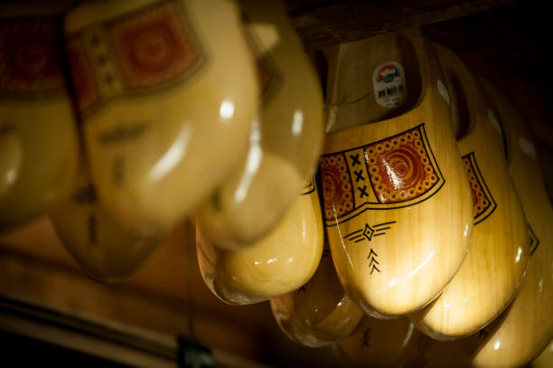 Traditional Dutch, Netherlands, Holland, wooden clogs for souvenir or traveling etc isolated on wooden background with copy space for your own text