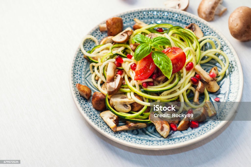 Delicious Zoodles with Mushrooms and Pomegranate Seed Pasta Stock Photo