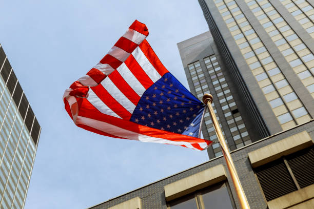 istock American flag against bright blue sky 679583832