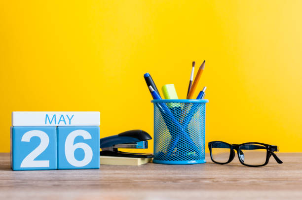 May 26th. Day 26 of month, calendar on business office table, workplace at yellow background. Spring time May 26th. Day 26 of month, calendar on business office table, workplace at yellow background. Spring time. number 26 stock pictures, royalty-free photos & images