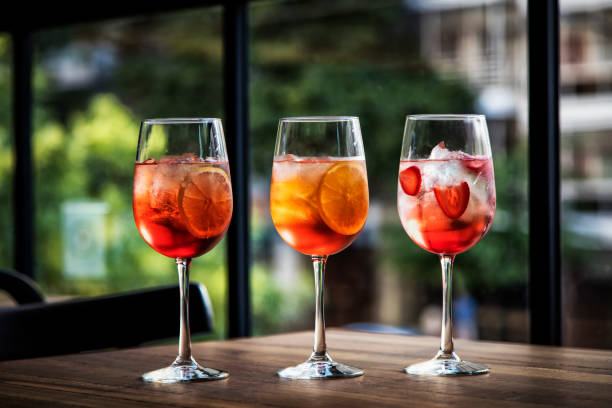 istock Spritz Italian cocktail - three variations - city background 679589330