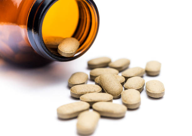istock Medicine spilling out of a bottle isolated 679603596