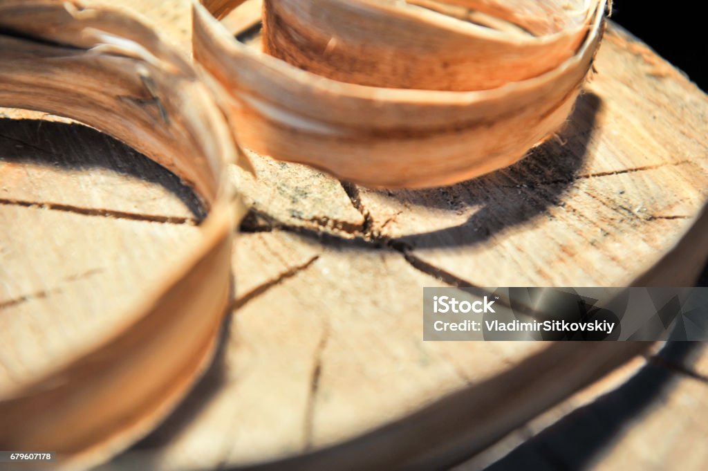 Stump of trees with rings of growth of a shiver are twisted from above. Concept of carpentry and home-making Tree stump with growth Tree stump with growth rings And a smiley of wood chips Backgrounds Stock Photo