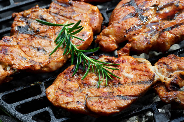 istock Meat during grilling. Chuck steak with herbs and spices 679614396