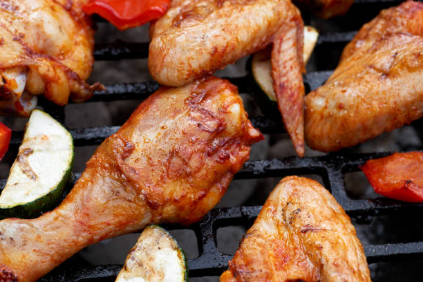 istock Meat and vegetables during grilling. Assorted types of chicken 679614414