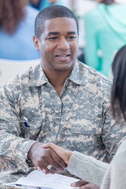 istock Military recruiter shakes hands with new recruit 679615228