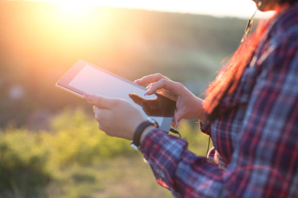 istock Young woman with digital tablet 679650478