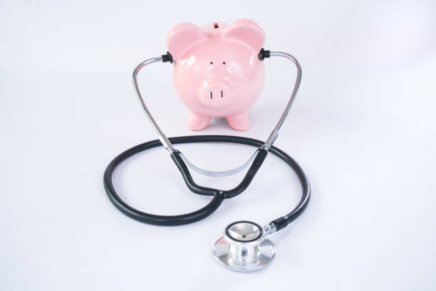 istock Pink Piggy Bank with Stethoscope 679660620
