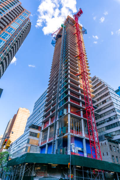 istock A crane building a skyscraper in New York City 679660788