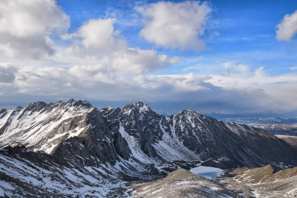 istock Cumulus clouds over a mountain massif 679661076