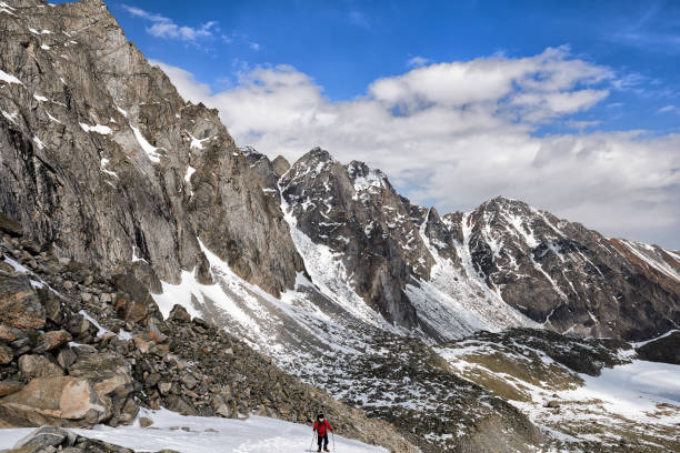 istock Slope of mountain range and one climber on rise 679661078