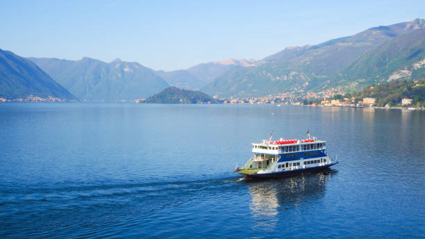 istock Ferry ride across Lake Como with mountain and blue sky background 679661498