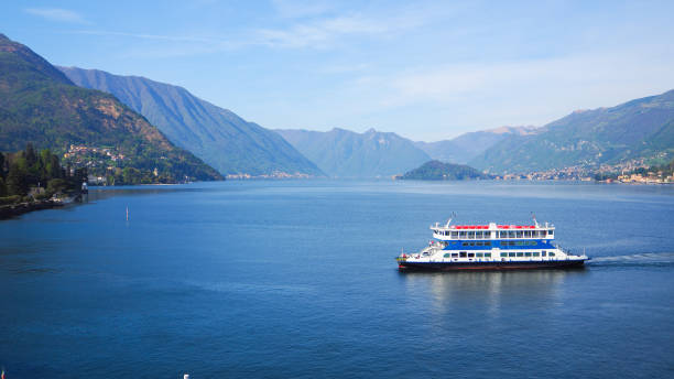 istock Ferry ride across Lake Como with mountain and blue sky background 679661564