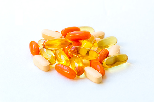 Vitamins and Healthy Supplements on white background.
