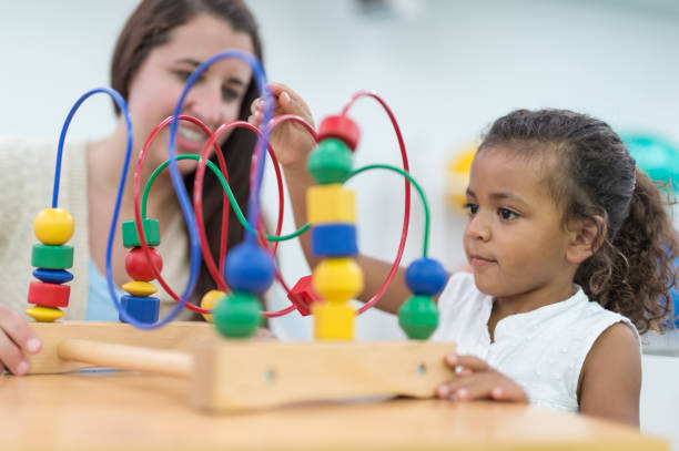 istock Exercising kids in physical therapy clinic 679688980