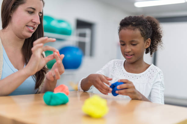 istock Exercising kids in physical therapy clinic 679688992
