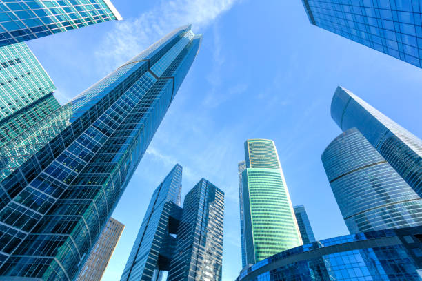 istock Clear blue sky over modern office buildings. Corporate background. 679711382