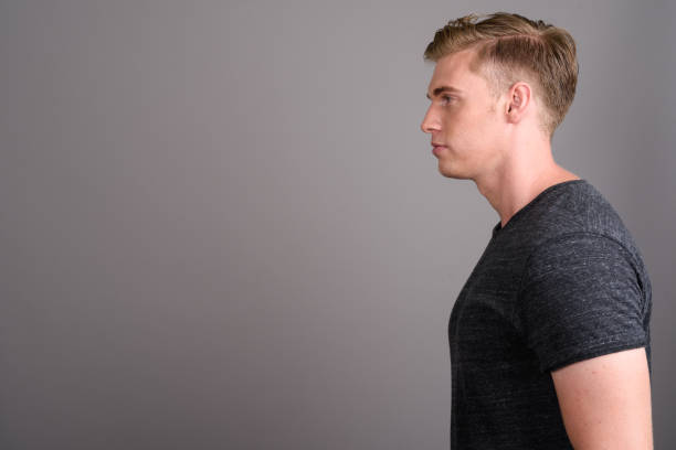 istock Studio shot of young muscular handsome man against gray background 679727476