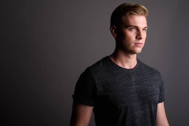 istock Studio shot of young muscular handsome man against gray background 679727704