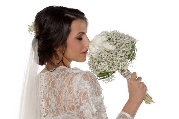 istock Young bride poses with bidermayer on a white background 679727724