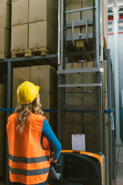 istock Female manual worker in warehouse 679728172
