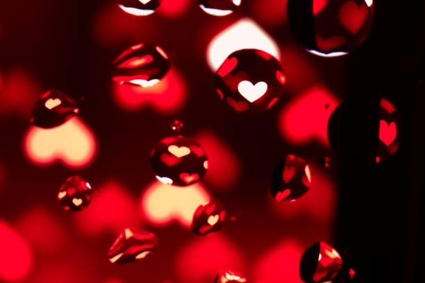 istock Abstract Background with Oil Drops on Red Hearts 679738296
