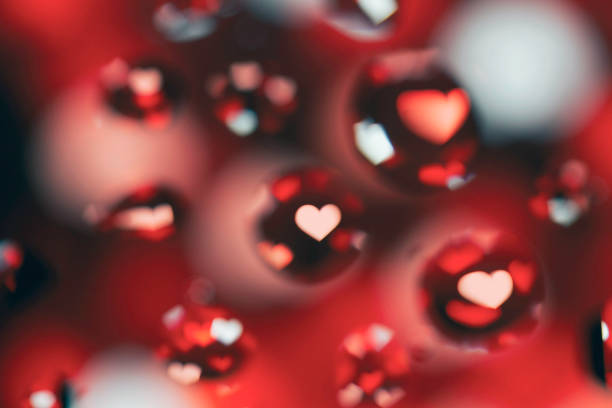istock Abstract Background with Oil Drops on Red Hearts 679738298